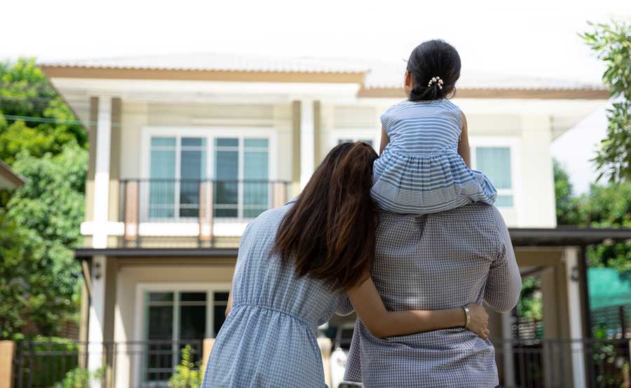 An Arlington family admiring their new home.
